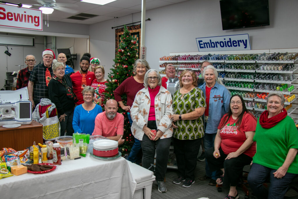 staff and guests and jims sewing christmas party